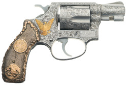 peashooter85:  Engraved and gold inlaid Smith and Wesson Model 60 double action revolver with Mexican style decorative motifs.