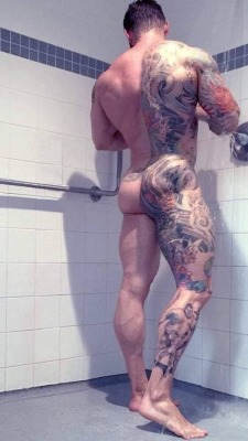 buddybate: muscleorlando:  Hump Day  The ink gets the attention of a lot of guys in the gym showers, but his big throbbing cock keeps them there. Once they start talking to him about his tattoos they see the meat he’s packing and they can’t help but