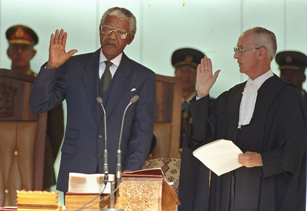 onceiwentblack:prepaidafrica:1. Nelson Mandela in 1952 at the law office he opened