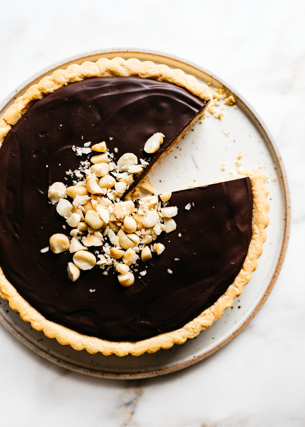 sweetoothgirl:    CHOCOLATE-CARAMEL MACADAMIA NUT TART    Uh&hellip;YES PLEASE!