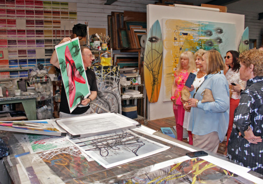 Artist Steve Miller and 2019 East End Studio Tour attendees in his studio.