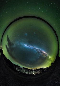 ponderation:  Starglobe by PaulWilsonImagesNZ   The lake surrounds the milky way, the intense green atmospheric airglow surrounds everything. But the thick spiral of our extremely hot and cold galaxy is still and always held highly on a pedestal in my