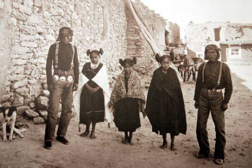 Hopi women with a characteristic “squash-blossom” hairstyle, early 1900s.