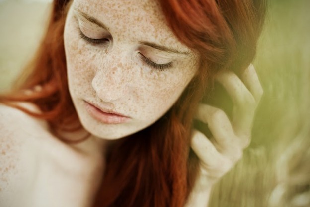 Cute teen girl redhead with freckles