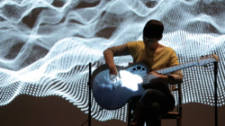 kickstarter:  Project of the Day — The Neck is a Bridge to the Body, guitarist Kaki King’s new performance, featuring live music and visuals projected directly onto the guitar. 