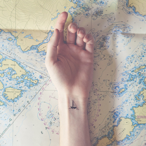 mymodernmet:Photographer Austin Tott pairs the small with the grandiose in his series Tiny Tattoos. 