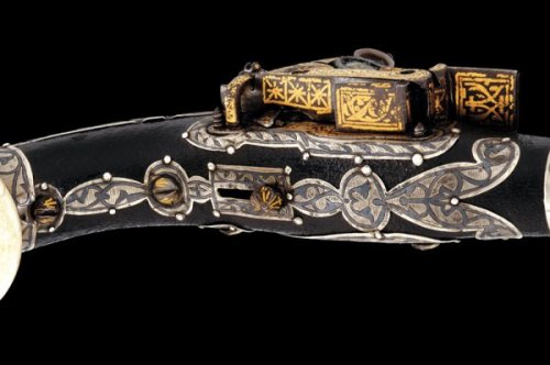 A gold and silver decorated Cossack’s miquelet pistol, 19th century.