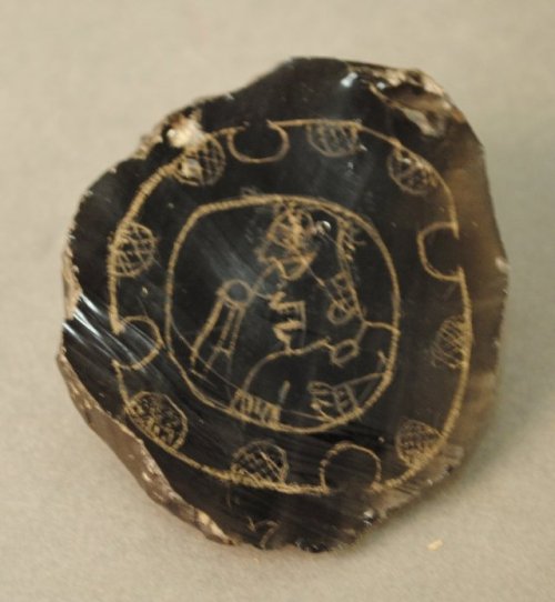mostly-history:Obsidian flakes, engraved with figures of Maya deities (Tikal,Guatemala, date unknown