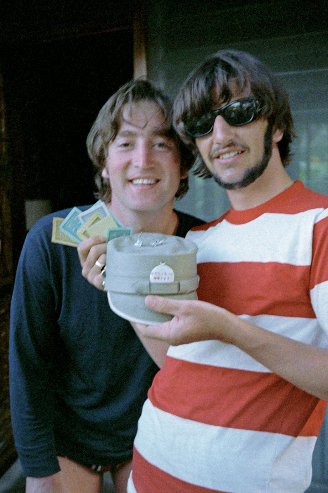 John Lennon and Ringo Starr (with his Monopoly winnings - paper money, earrings, and a cap) holidaying in Trinidad & Tobago, from Ringo Starr’s personal collection. (January 12th-23rd, 1966)
-
We were on holiday here. And we were having a good time....
