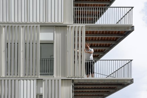 archatlas: Social Housing rue CastagnaryWhite metal louvres covering the facade of this apartment bl