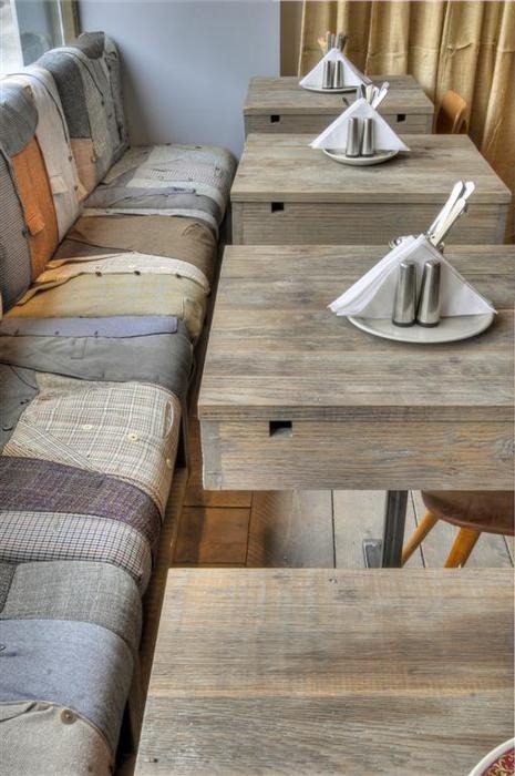 unconsumption:  We’ve spotted an example of seat cushions upholstered with old