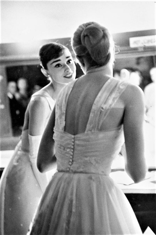 80s90sthrowback: Audrey Hepburn and Grace Kelly backstage at the 28th Academy Awards, 1956.