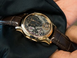 watchanish:  We got exclusive access to the Romain Gauthier Logical One last week. It winds with a push button on the side and uses a fusee chain/snail cam set with rubies. And it costs the same as a house! Have a look at this crazy watch on The Watch