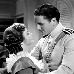 classicactresses:  Olivia de Havilland &amp; Errol Flynn + Kisses  MOVIES -Captain