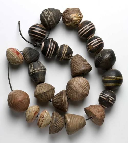 theiainteriordesign:Clay whorls, some painted