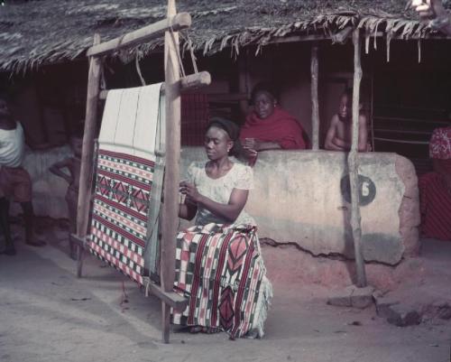 ukpuru:  An Igbo woman works at her loom in a traditional weaving establishment, Aba, Nigeria. Torto