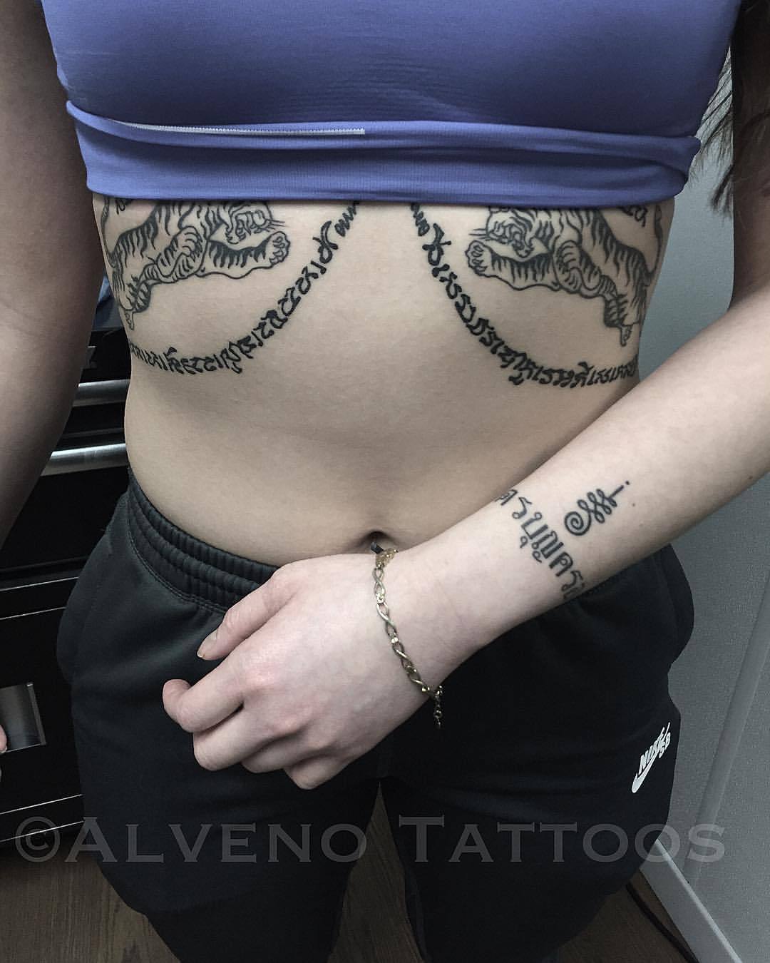 women stomach lettering tattooTikTok Search