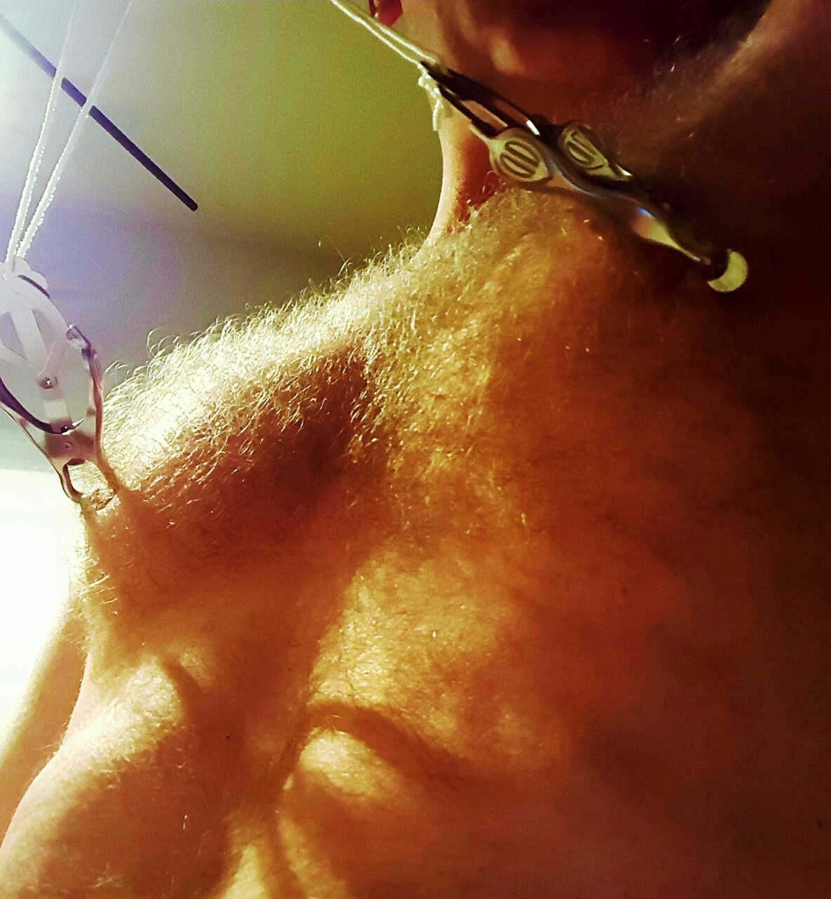 virtualotherme:  Torturing my nipples with clamps. The exquisite pain making my cock
