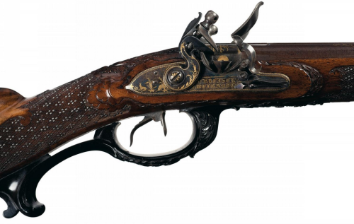 Magnificent 18th century German double barrel flintlock rifle with carved stock and gold inlaid barr