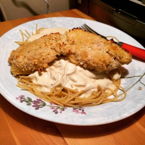 Gluten-free spaghetti with homemade Alfredo sauce and baked chicken with homemade, GF breading. It 