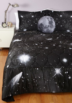 startorialist:  Surround yourself in the Universe with modcloth&rsquo;s Spaced Out quilt and pillow shams, and Soft Side of the Moon pillow. They make a charming combination for a deep space sleep! —Emily