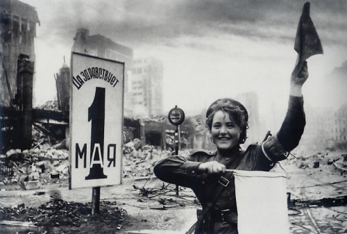historicaltimes:  Mariya Shalneva  directs traffic in the ruins of Berlin, 2 May 1945. Photo: Yevgeniy Khaldey via reddit