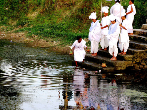 Maibi priestess making offerings to Water Goddess, Manipur