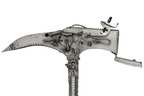 Early 17th Century Combination warhammer and warpick/six shot gun.  Has six barrels concealed on it 
