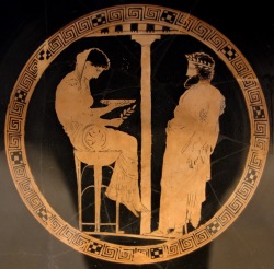 lionofchaeronea:King Aegeus of Athens consults the goddess Themis (Natural Law).  Tondo of an Attic red-figure kylix, attributed to the Codros Painter; ca. 440-430 BCE.  Found at Vulci; now in the Altes Museum, Berlin.