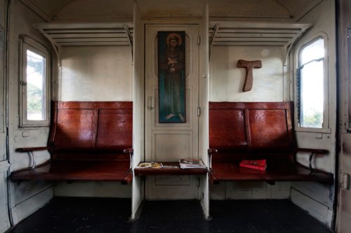 In Scampia (a suburb of Naples), eight Franciscans have turned 5 railway cars from 1940s into a conv