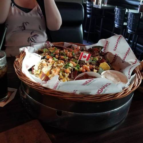 … And that’s a HALF order… Welcome to Canada! #nachos #nacho #calgary #canada #c