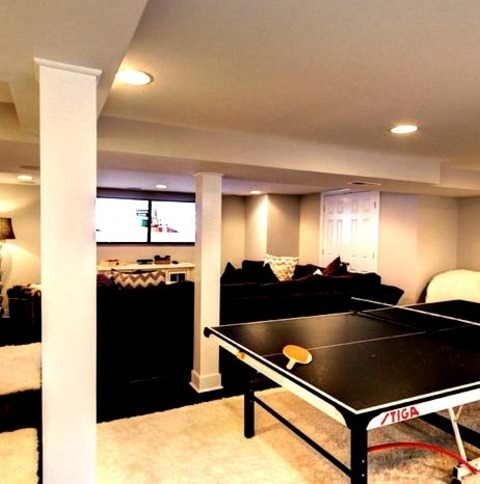 Underground RichmondLarge Eclectic Underground Concrete Floor Basement Photo With White Walls And No