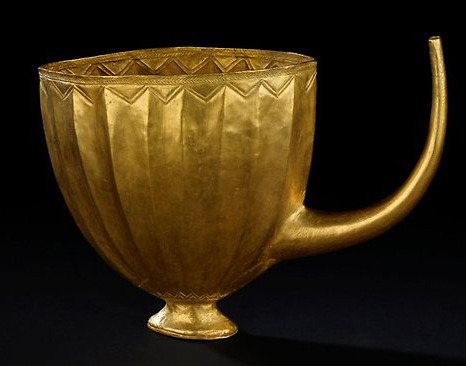 A gold ancient Sumerian beer mug dating to 2,500 BC.  The straw was used to filter out particles whi