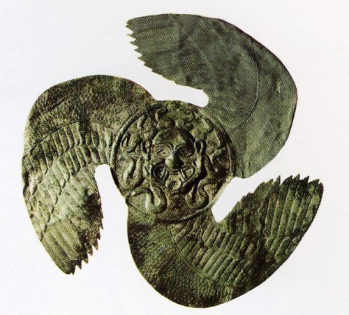 illvedere:  Bronze shield device in the shape of a winged Gorgon head from Olympia.1st half of the 6