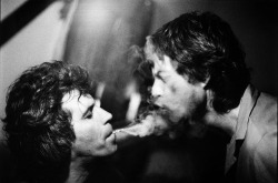 computerbug:  Keith Richard’s blowing smoke into Mick Jagger’s face. 1981.