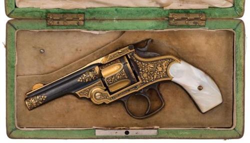 Gold damascened Spanish copy of a Smith &amp; Wesson revolver with pearl grips. Marked &