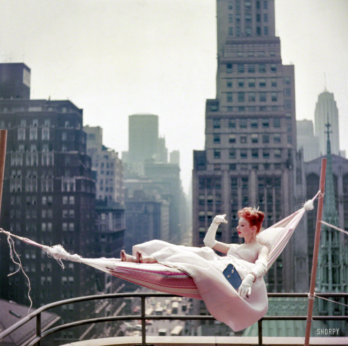 artfulfashion:May 1953. “Dancer-actress Gwen Verdon in a hammock wearing a ballgown.” Co