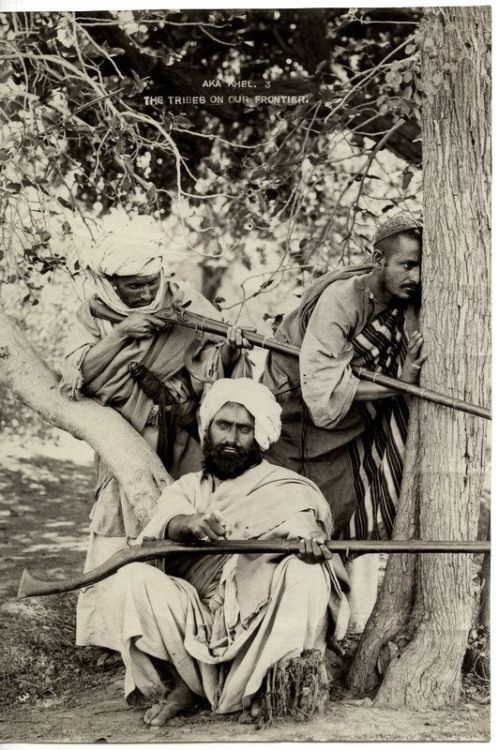 Afghan tribesmen firing jezail muskets, late 19th century.