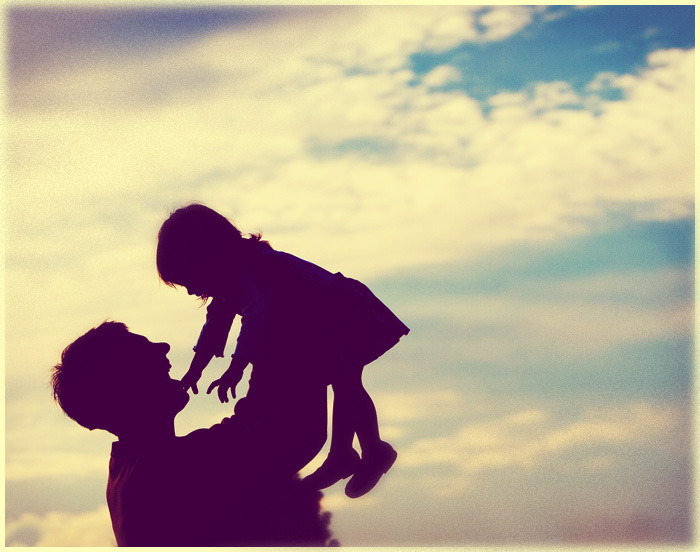 Father and daughter holding hands