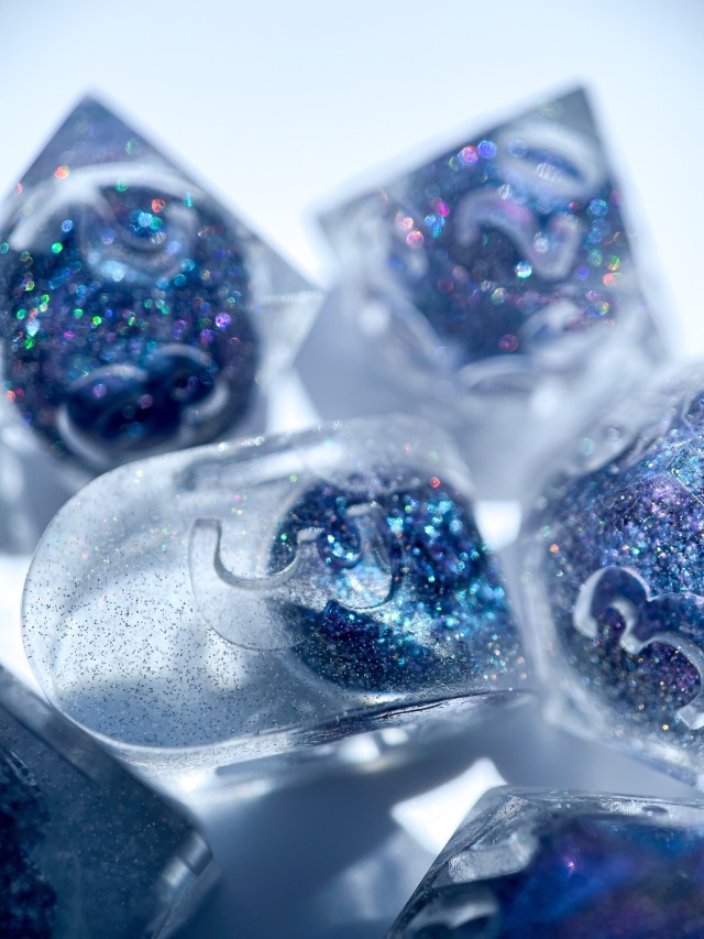 sparkly dice with equally sparkly blue liquid cores