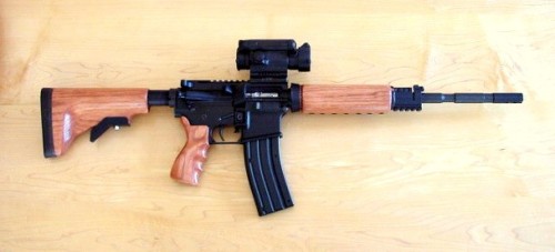 gunrunnerhell:  CustomA CMMG Quebec-A with wooden furniture. The Quebec-A is a dedicated .22 LR AR-15, although I’m not exactly sure why it has that name. I’ve seen wooden stocks for the AR-15 but mostly as a fixed A2 style. It’s interesting to