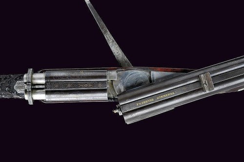 peashooter85:  A rare Dreyse pinfire double rifle originating from Germany, mid 19th century.  Beautifully & ornately engraved scroll work. -fms