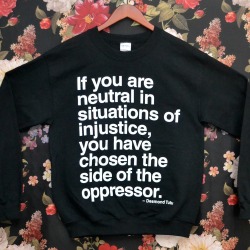 wickedclothes:  Wicked Clothes presents our latest item: the ‘Neutral’ Sweater! &ldquo;If you are neutral in situations of injustice, you have chosen the side of the oppressor. If an elephant has its foot on the tail of a mouse, and you say that you