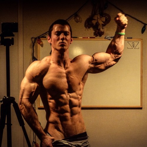 beautifulyoungmuscle:The stunning flexed biceps of Zach Zeiler. Piled high with muscle, studded with veins, rippling with mass and power, they’re erotic totems of beautiful young muscle.