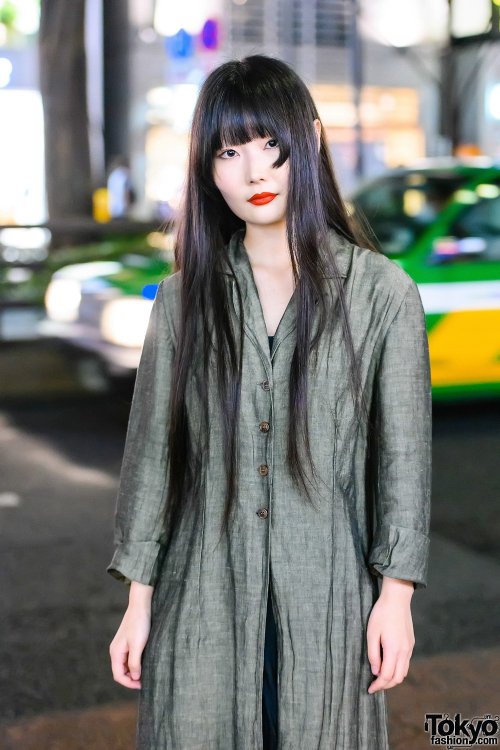 20-year-old Japanese student Kana on the street in Harajuku wearing a vintage linen maxi coat over a