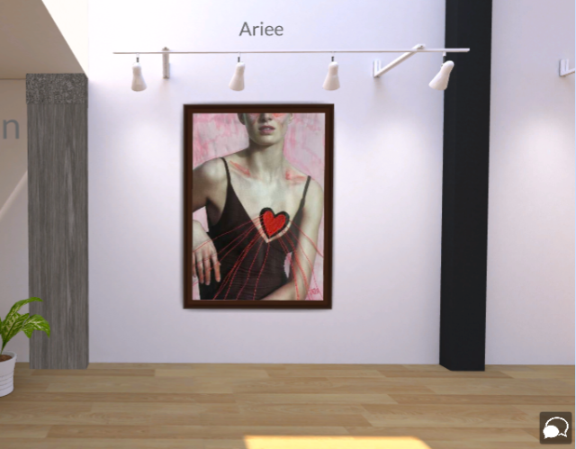 Screenshot of a piece of art displayed in a virtual gallery scene. Above the work is the artist name "Ariee" in grey text. The art piece is a cut out collage image of a woman below the eye line, stuck on a pink ink background. The woman is wearing a low cut black strap dress, and on her chest a red felt heart is sewn on, with lines of red thread coming out from the heart shape. Her fingertips, collarbone and below the eyelids are outlined with pink ink. In the bottom right hand corner is the artist initial "R.E" written in pink.