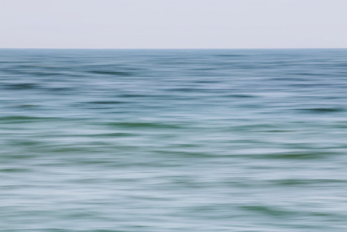 Gentle sea waves from the side island of Helgoland, called Düne. Original sharpness, photographed wi