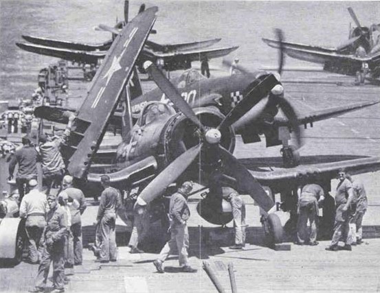 usaac-official:F4U-4s of VMF-312 prepare for a mission aboard USS Bataan (CVL-29)