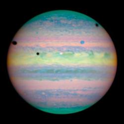 back-to-the-stars-again: Three moons cast shadows on Jupiter.  Credit: NASA, ESA and E Karkoschka 