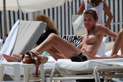 toplessbeachcelebs:  Yaya Kosikova (Model) sunbathing topless in Miami Beach (March 2011) 
